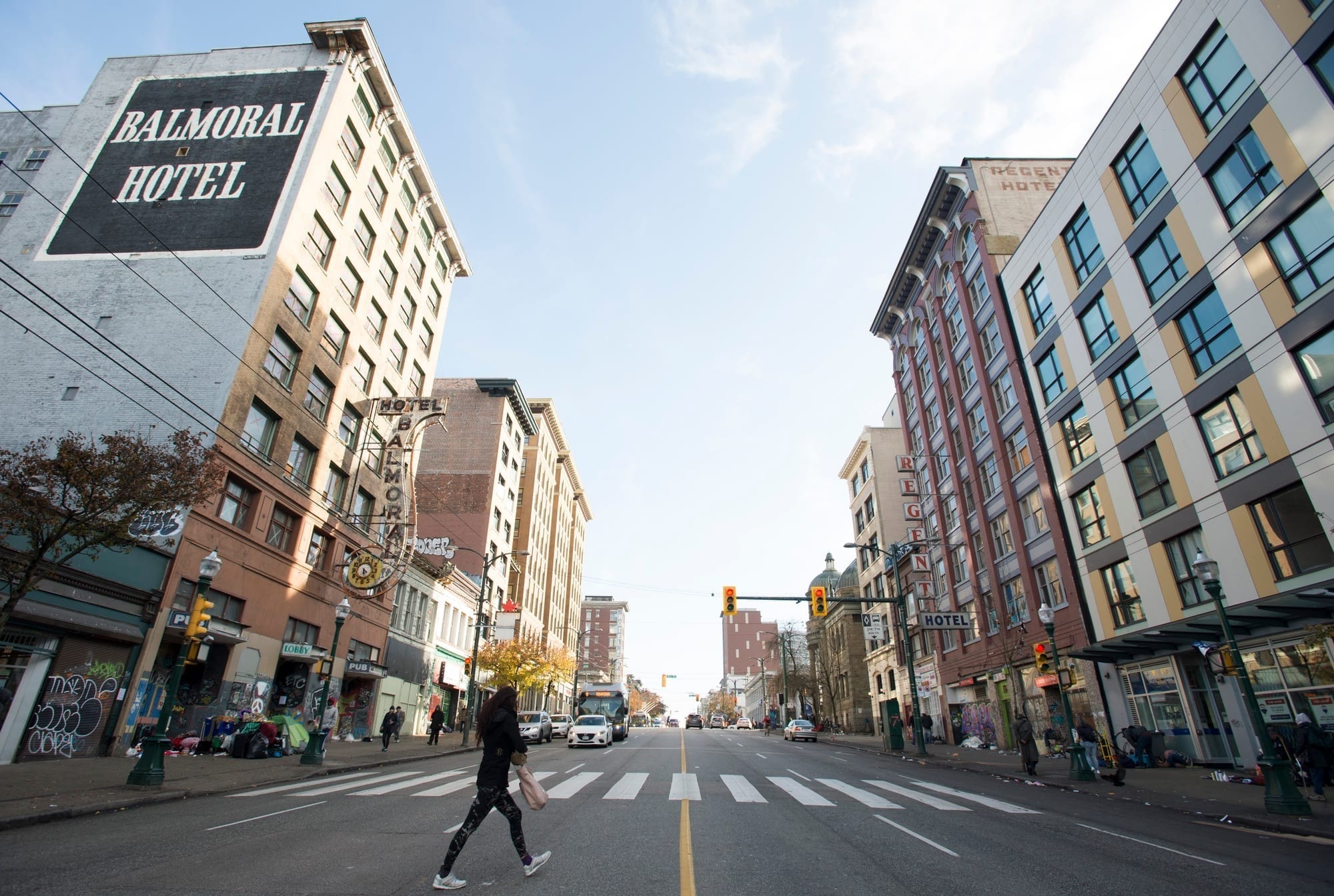 A pedestrian crosses a East Hastings Street in Vancouver, B.C.