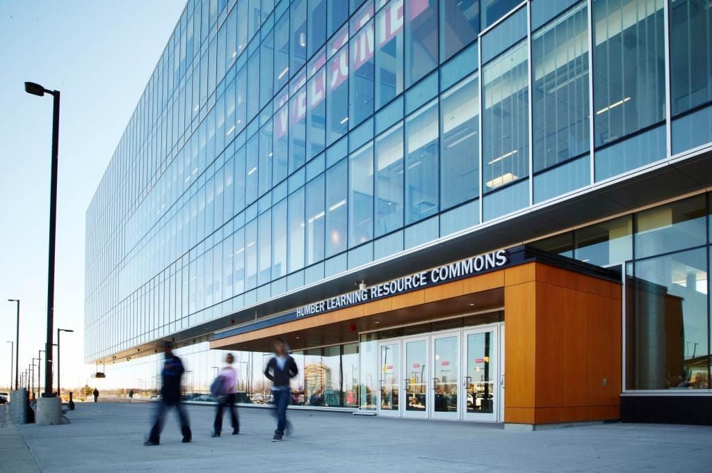 People walk in front of Humber College's Learning Resource Commons at the college's North Campus in Etobicoke.