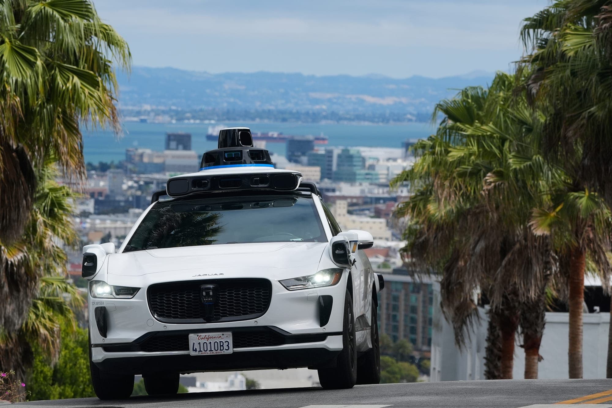 A Waymo car drives up a hill in San Francisco, on Sept. 4, 2025.