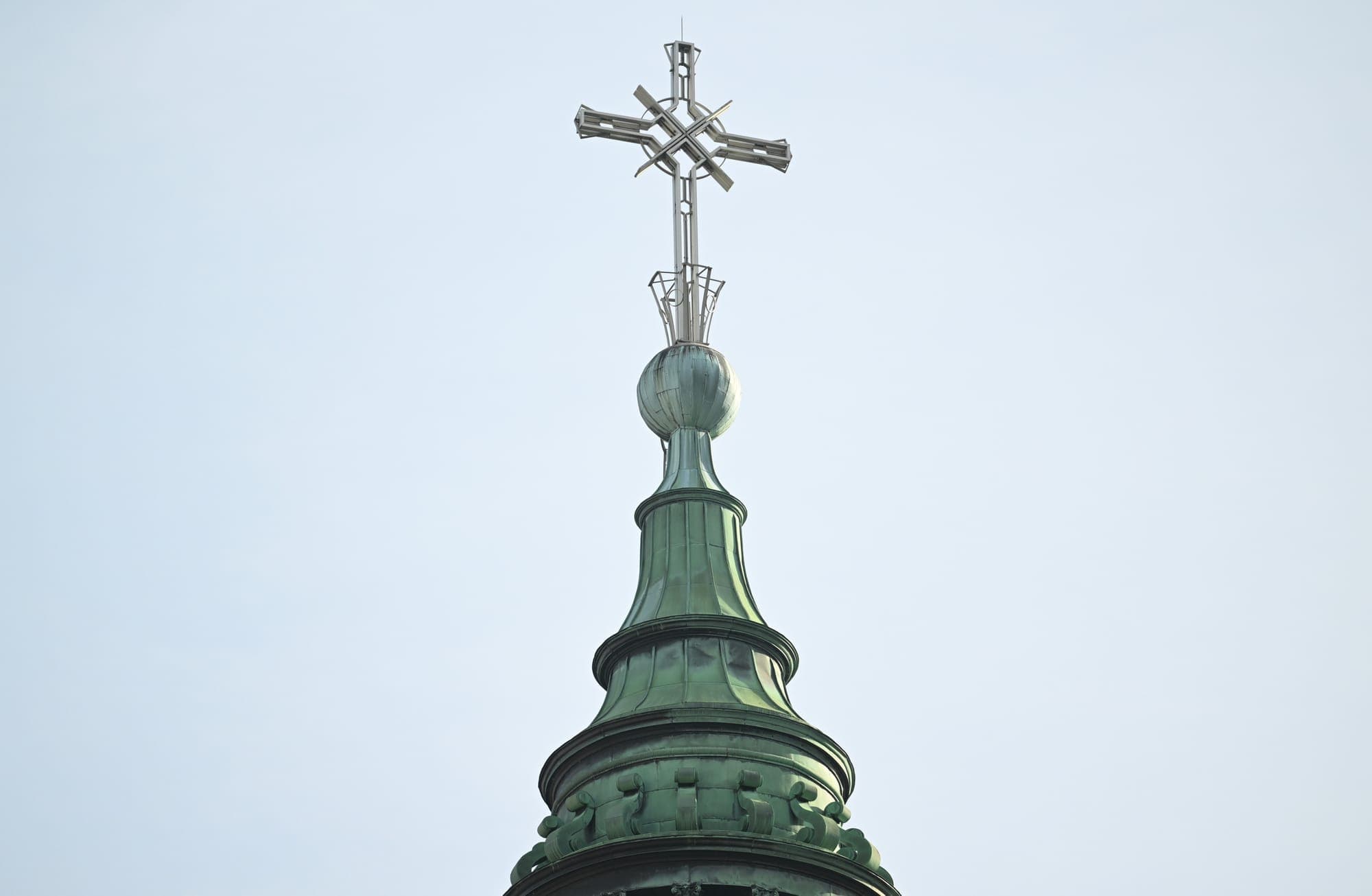 A cross is shown on a church steeple.