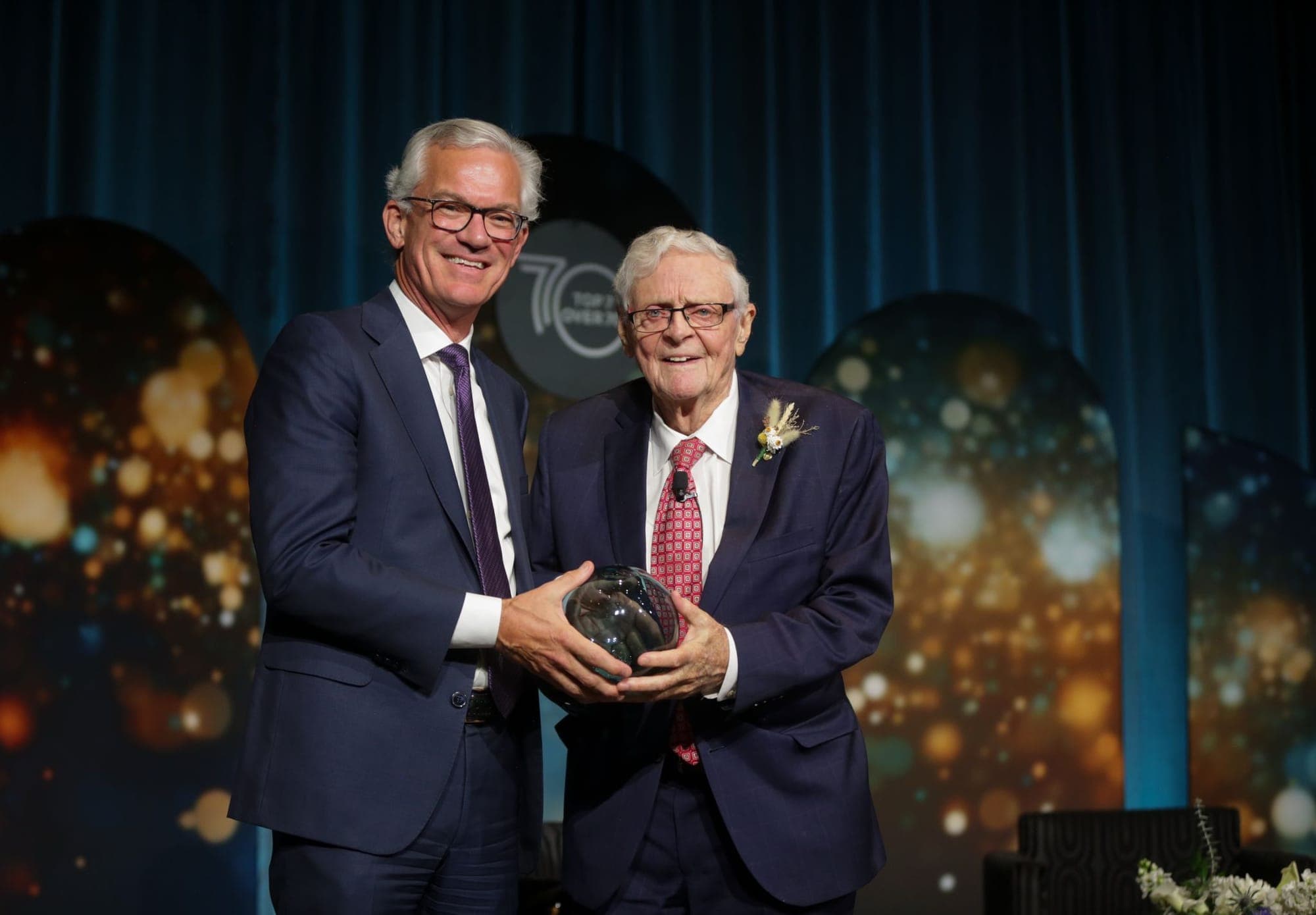 National Bank of Canada vice president Michael Denham presents Dr. Neil Webber with an award.