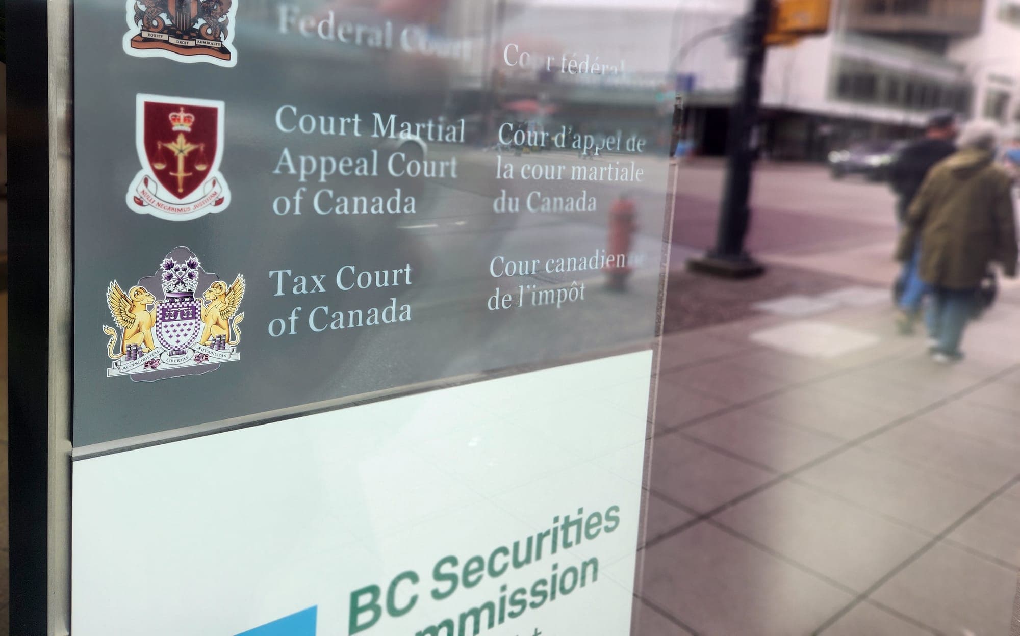 A sign in a window advertises the Tax Court of Canada along with other federal courts.