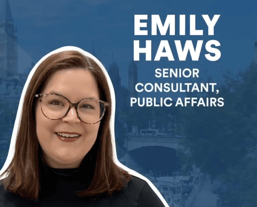 A headshot of a woman with glasses in front of text that reads "Emily Haws, senior consultant, public affairs"