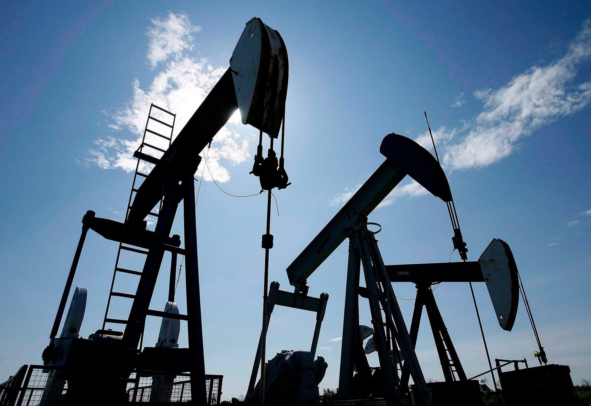 Pumpjacks at work pumping crude oil near Halkirk, Alta., June 20, 2007.