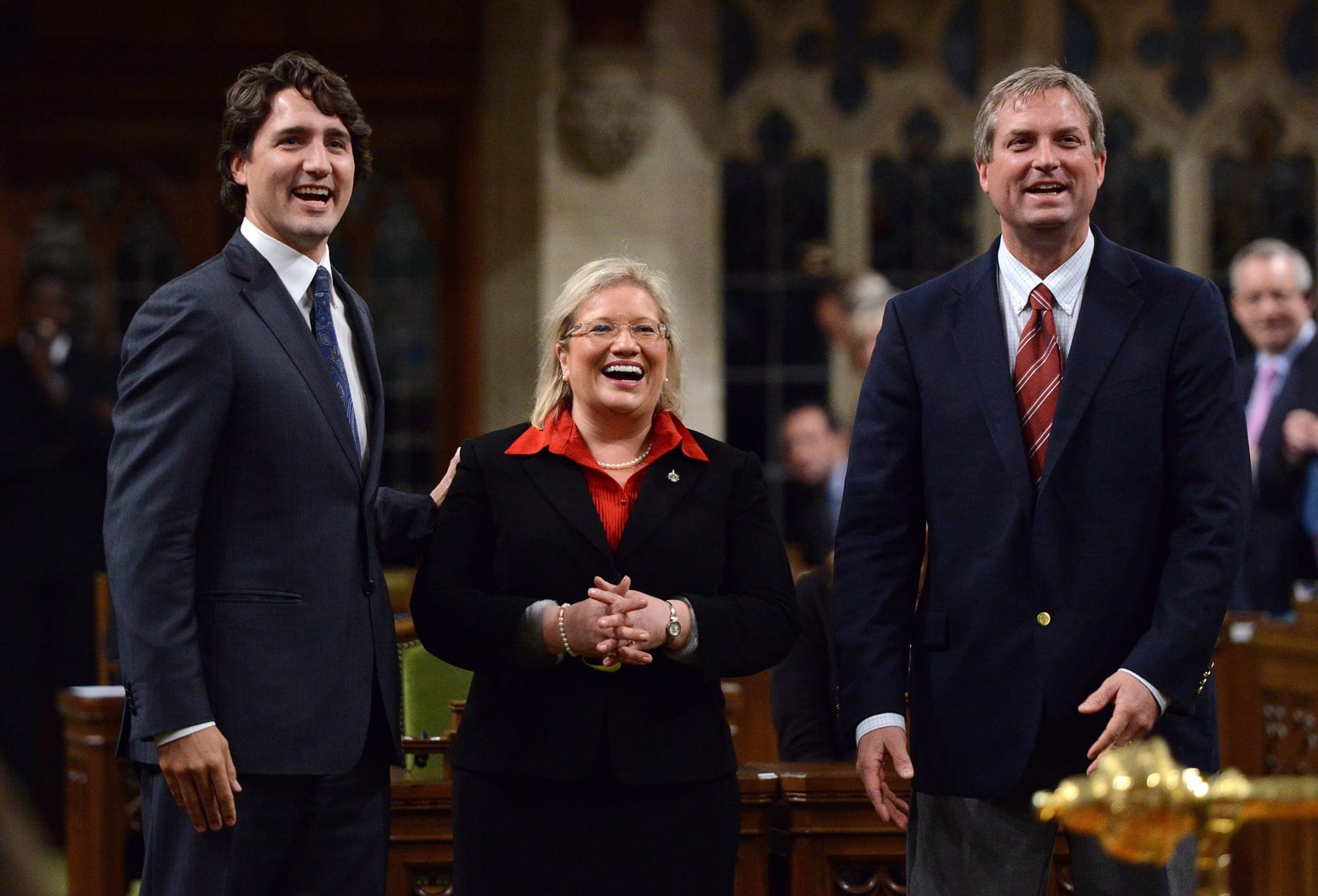 Yvonne Jones then-MP for Newfoundland and Labrador is led into the House of Commons by Justin Trudeau (left) and Gerry Byrne (right) in Ottawa on June 4, 2013.