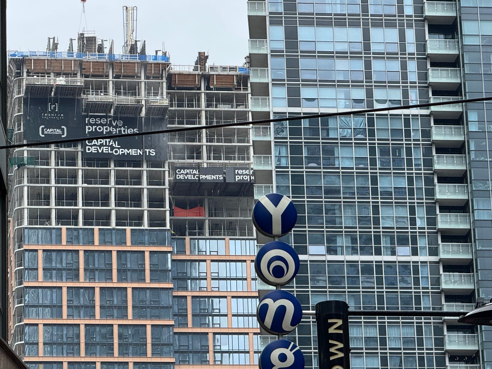 Exterior of a high-rise condo building under construction in downtown Toronto.