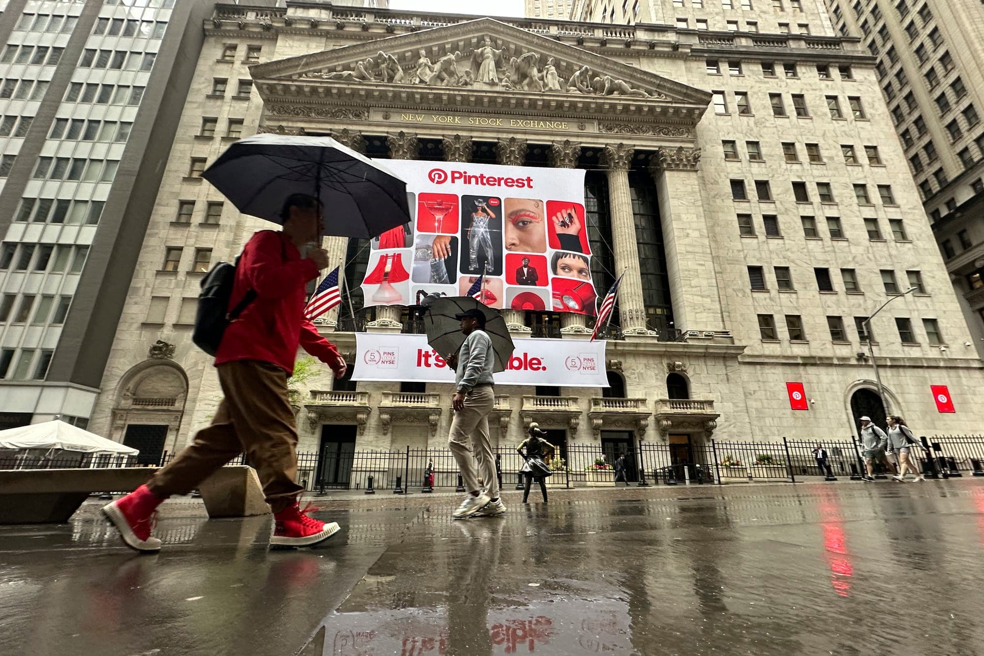 Banners for Pinterest, displayed to mark the fifth anniversary of the company's listing, hang on the front of the New York Stock Exchange in New York.