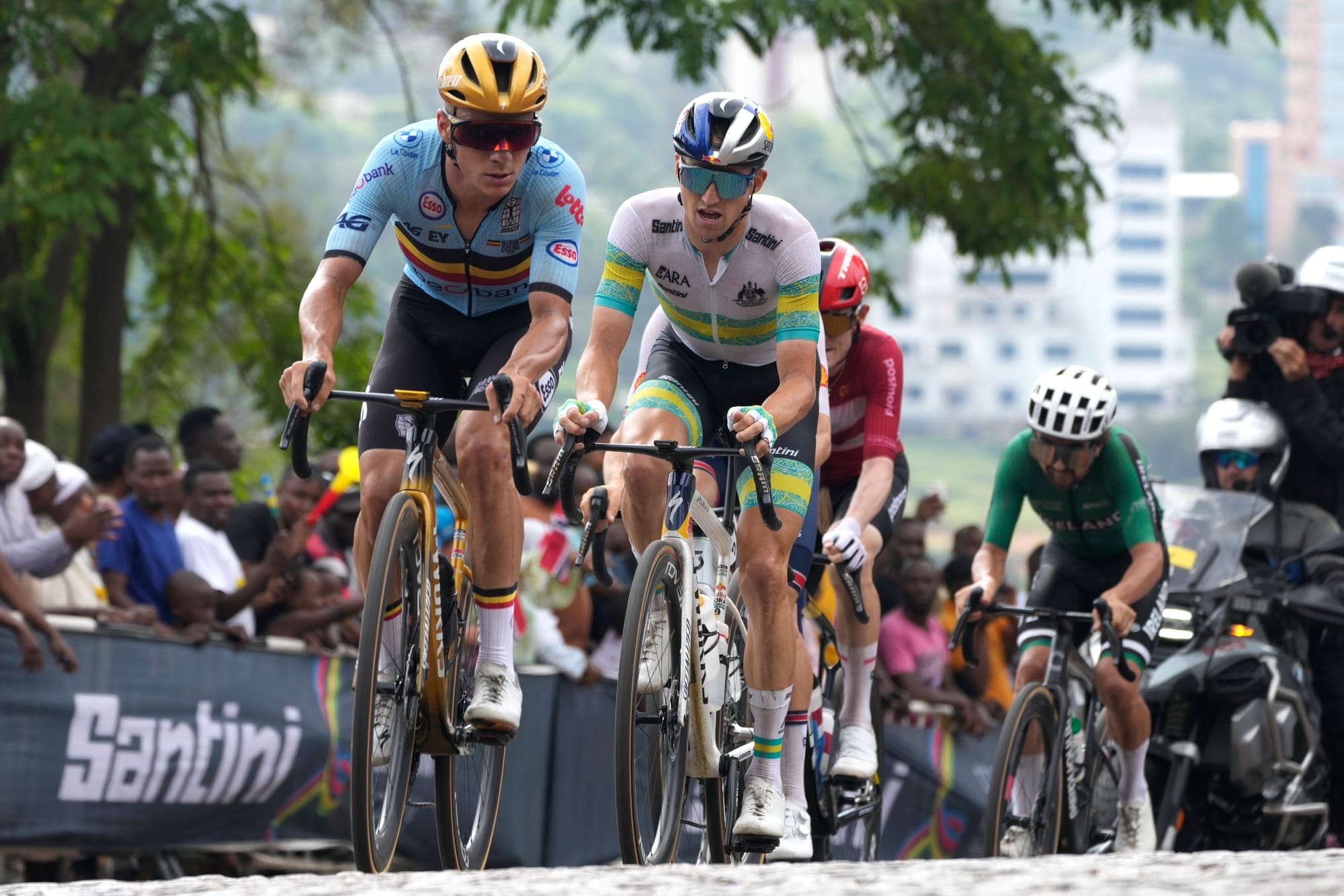 Cyclists battle for the lead during the men's elite road race, at the 2025 road cycling World Championships in Kigali, Rwanda.