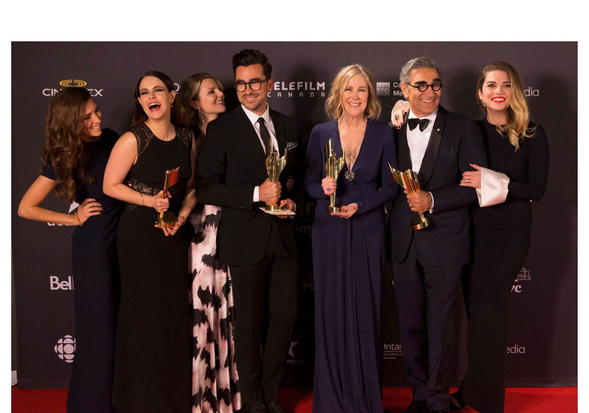 Cast members from 'Schitt's Creek' hold their multiple awards at the Canadian Screen Awards in Toronto in 2016.