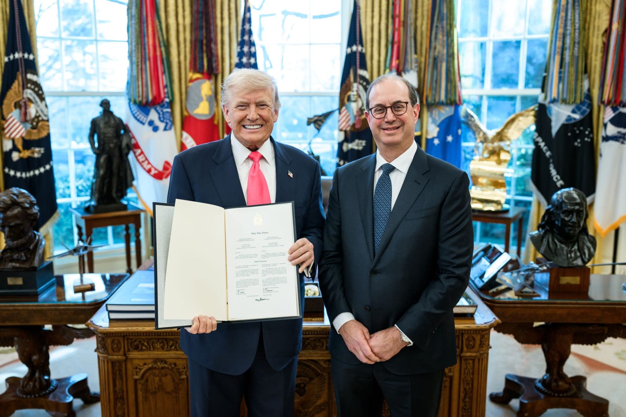 Canada's ambassador to the United States, Mark Wiseman (right) stands next to U.S. President Donald Trump in the Oval Office.