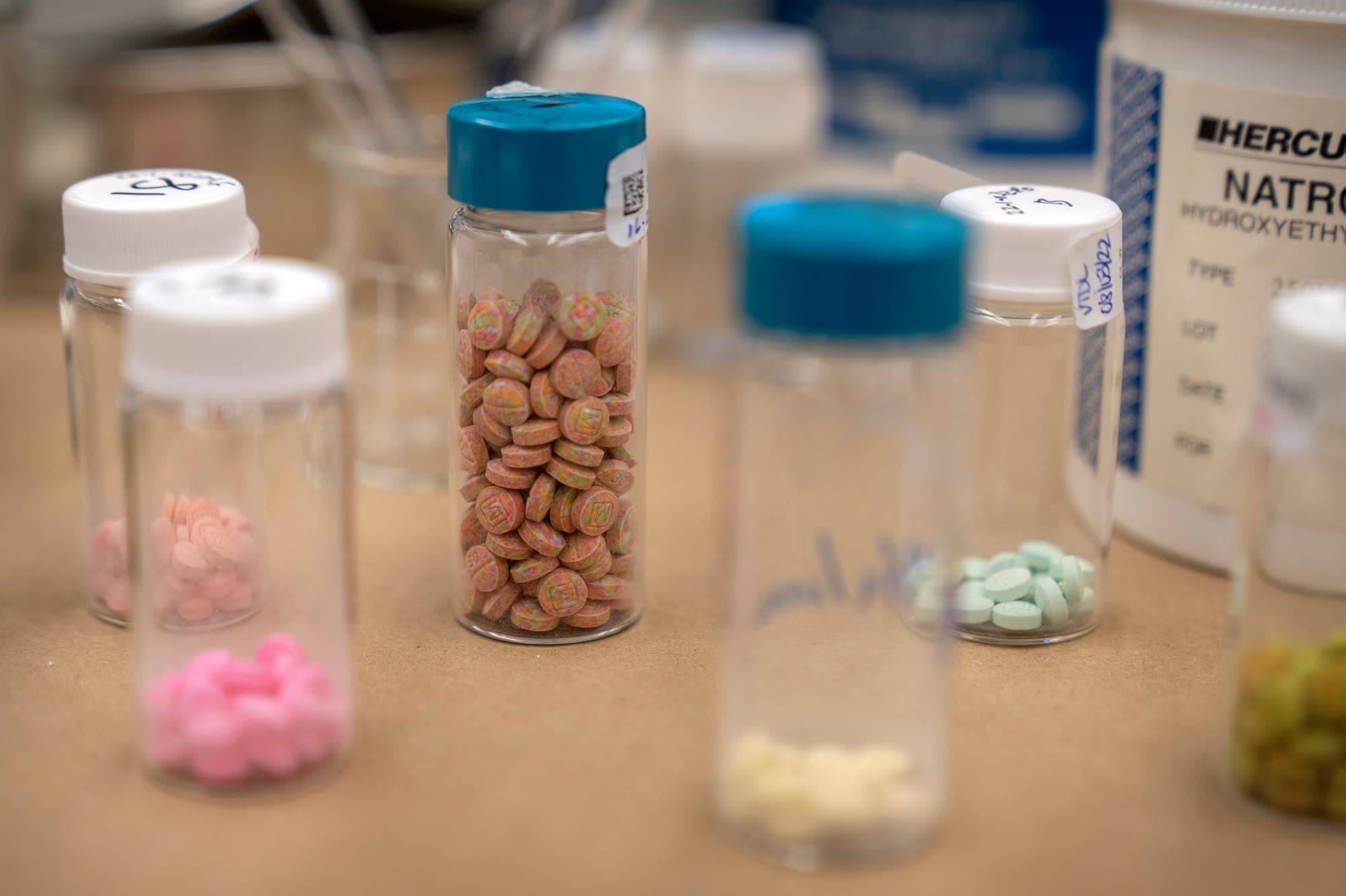 Containers of fentanyl pills are displayed at a Drug Enforcement Administration research laboratory on April 29, 2025, in Northern Virginia.