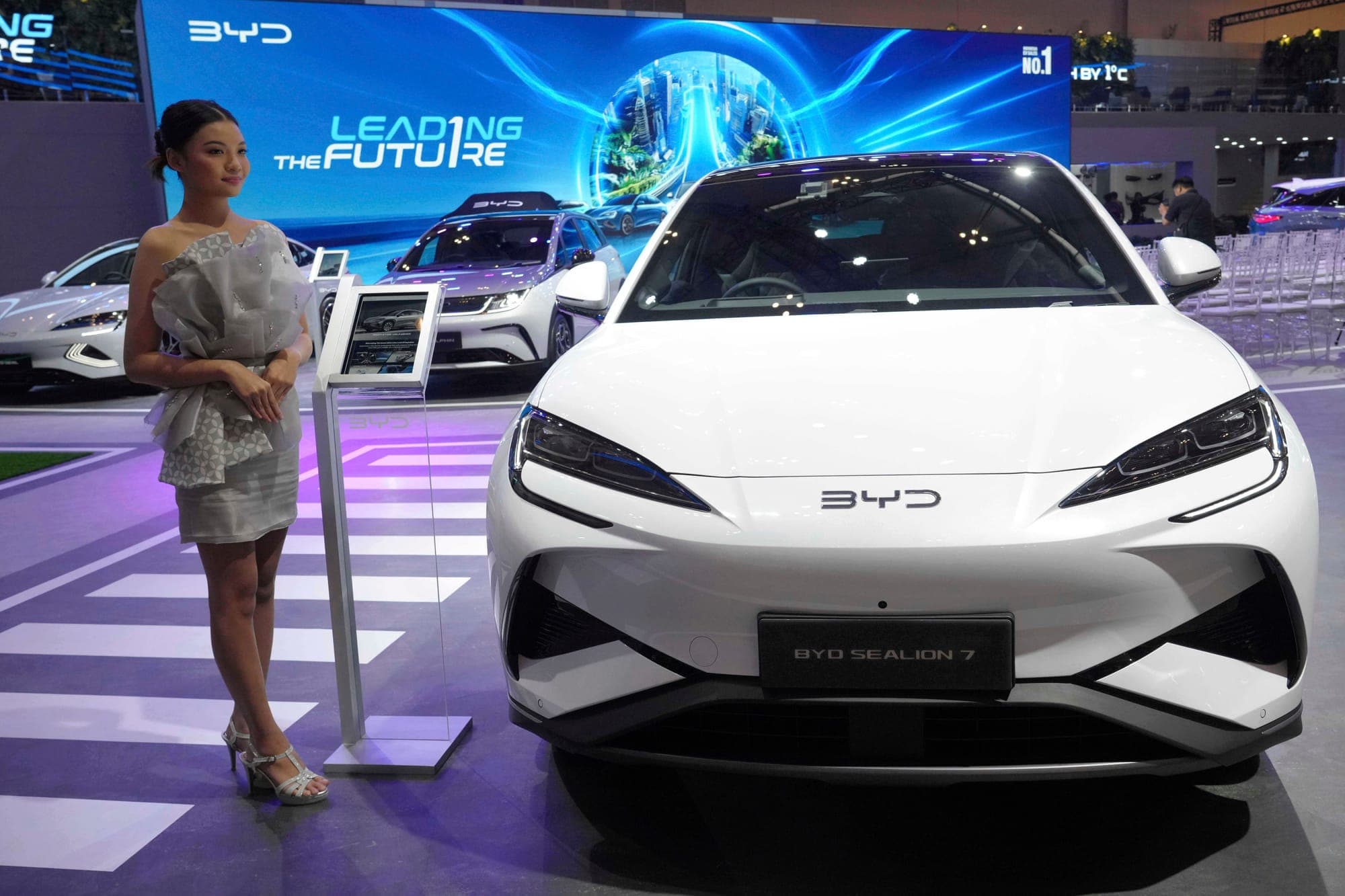 A model stands near a Sealion 7, an electric vehicle from Chinese automaker BYD, during the Gaikindo Indonesia International Auto Show in Tangerang, Indonesia July 23, 2025.