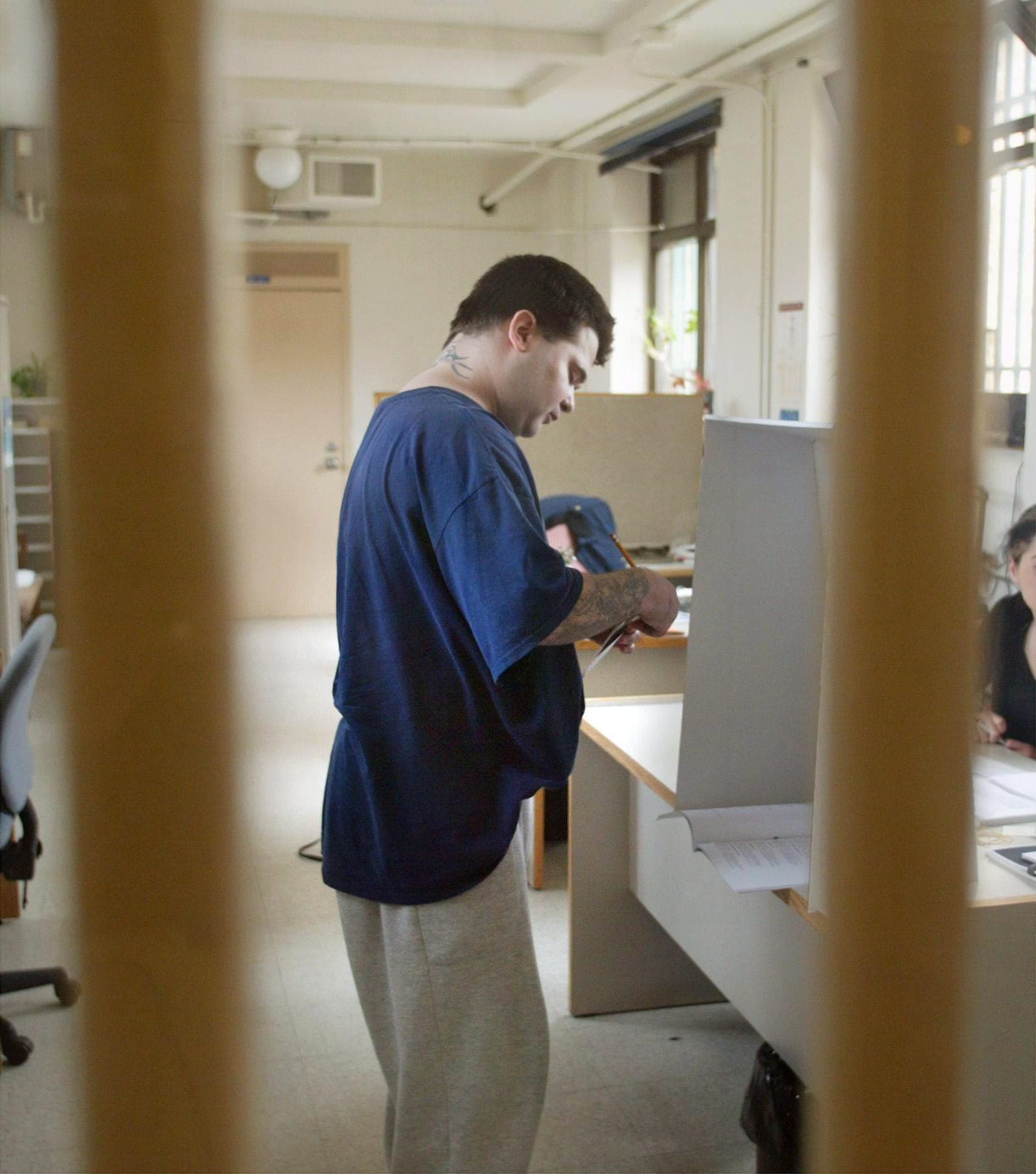 Inmate Stephane Lejour casts his ballot for the federal election at the Montreal Detention Centre, formerly know as Bordeaux, on Friday, June 18, 2004.