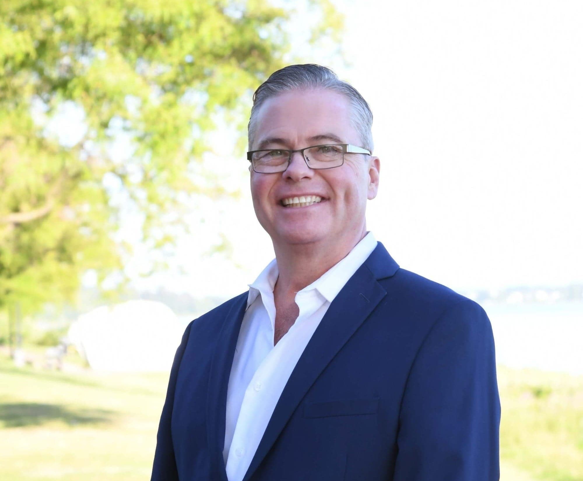 Mayor-elect of White Rock, B.C., Chris Shields, is pictured outside in a grassy area.